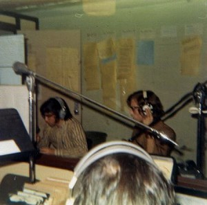 Alan J. Friedman (left) delivering the news
